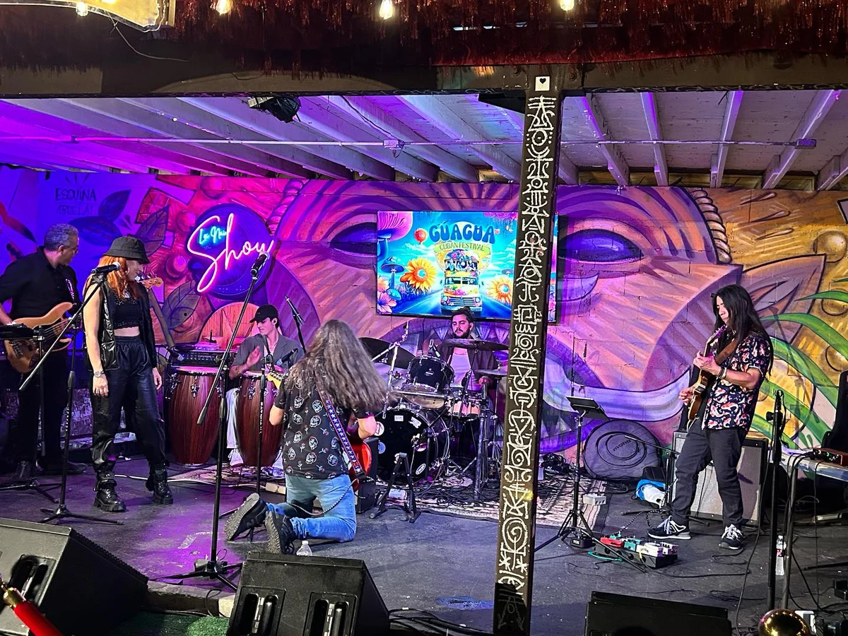 A live performance on the Guagua festival stage, surrounded by the event’s colorful visual setting.